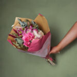 Bright_pink_dried_flower_bouquet_wrapped_in_pink_and_brown_paper_rb30