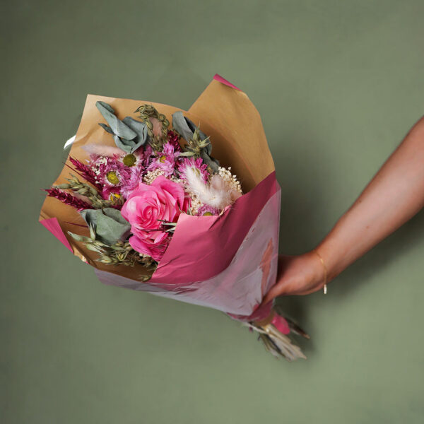 Bright_pink_dried_flower_bouquet_wrapped_in_pink_and_brown_paper_rb30